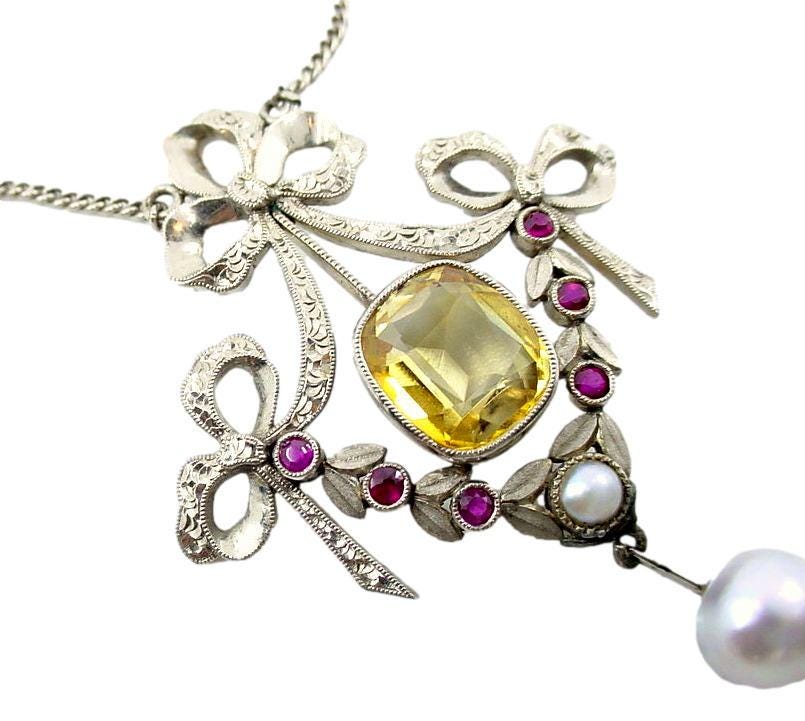 Lyrical European Belle Époque Citrine Ruby White Gold Lavaliere Ribbon Pendant